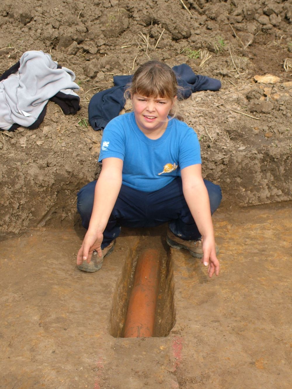 Sarah excavating a drain at Knights Templar site